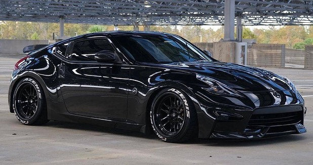 Black Nissan 370z with Front Aftermarket Cosmis Wheels XT-206R Black 18x9.5 +10mm