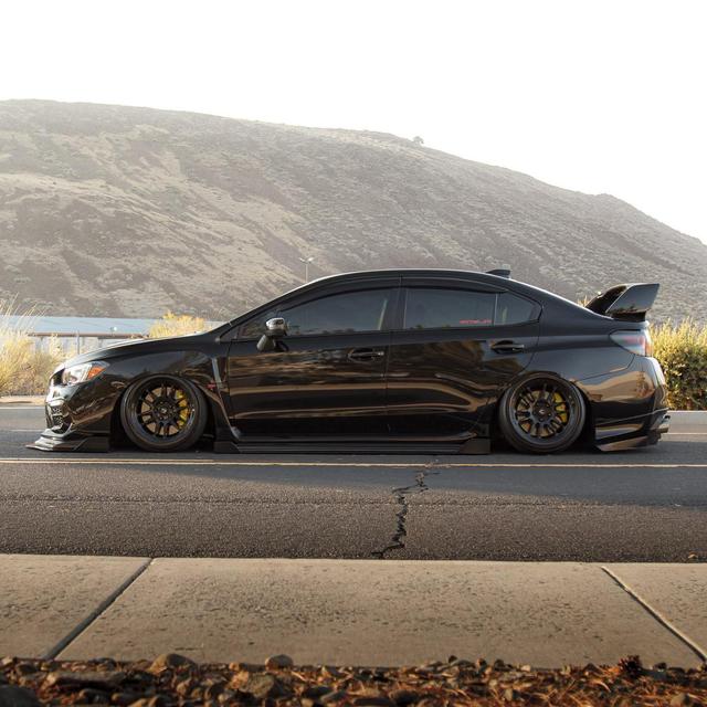 Black Subaru STI with Aftermarket Cosmis Wheels XT-206R Black 18x9.5 +10mm