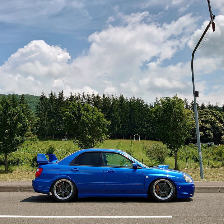 WRB Subaru STI with Cosmis XT-006R Gunmetal 18x9 +30mm 5x114.3 Wheels