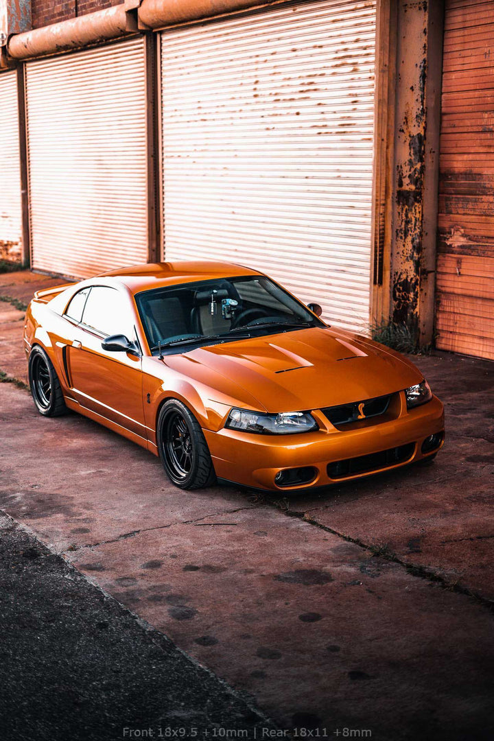 SN95 4th Gen Ford Mustang Cobra with Front Aftermarket Cosmis Wheels XT-206R Black 18x9.5 +10mm