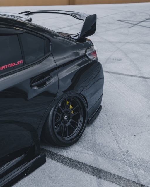 Black Subaru STI with Aftermarket Cosmis Wheels XT-206R Black 18x9.5 +10mm