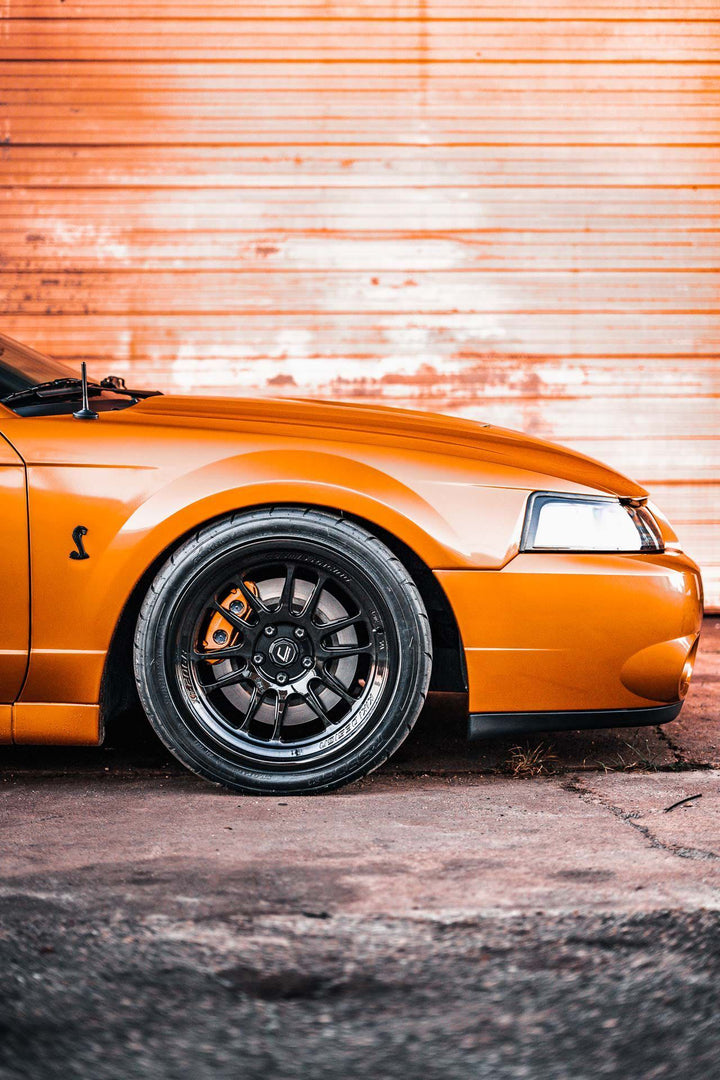 SN95 4th Gen Ford Mustang Cobra with Front Aftermarket Cosmis Wheels XT-206R Black 18x9.5 +10mm