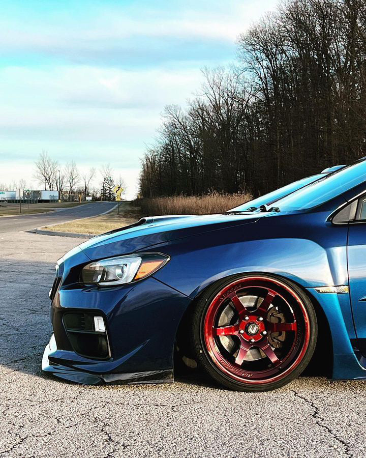 Bagged Subaru WRX with Cosmis XT-006R Hyper Candy Red Wheels 18x9.5 +10 5x114.3