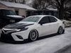 Bagged 2020 Toyota Camry with Aftermarket Cosmis Silver XT-206R 20x9 +35 5x114.3 Wheels