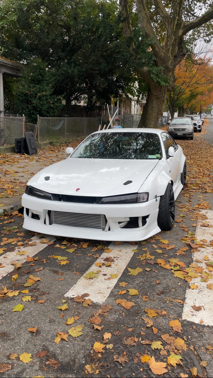 Widebody Nissan 240sx S14 with Aftermarket Cosmis Wheels MRII Black 17x9 +10 and 25mm Spacers